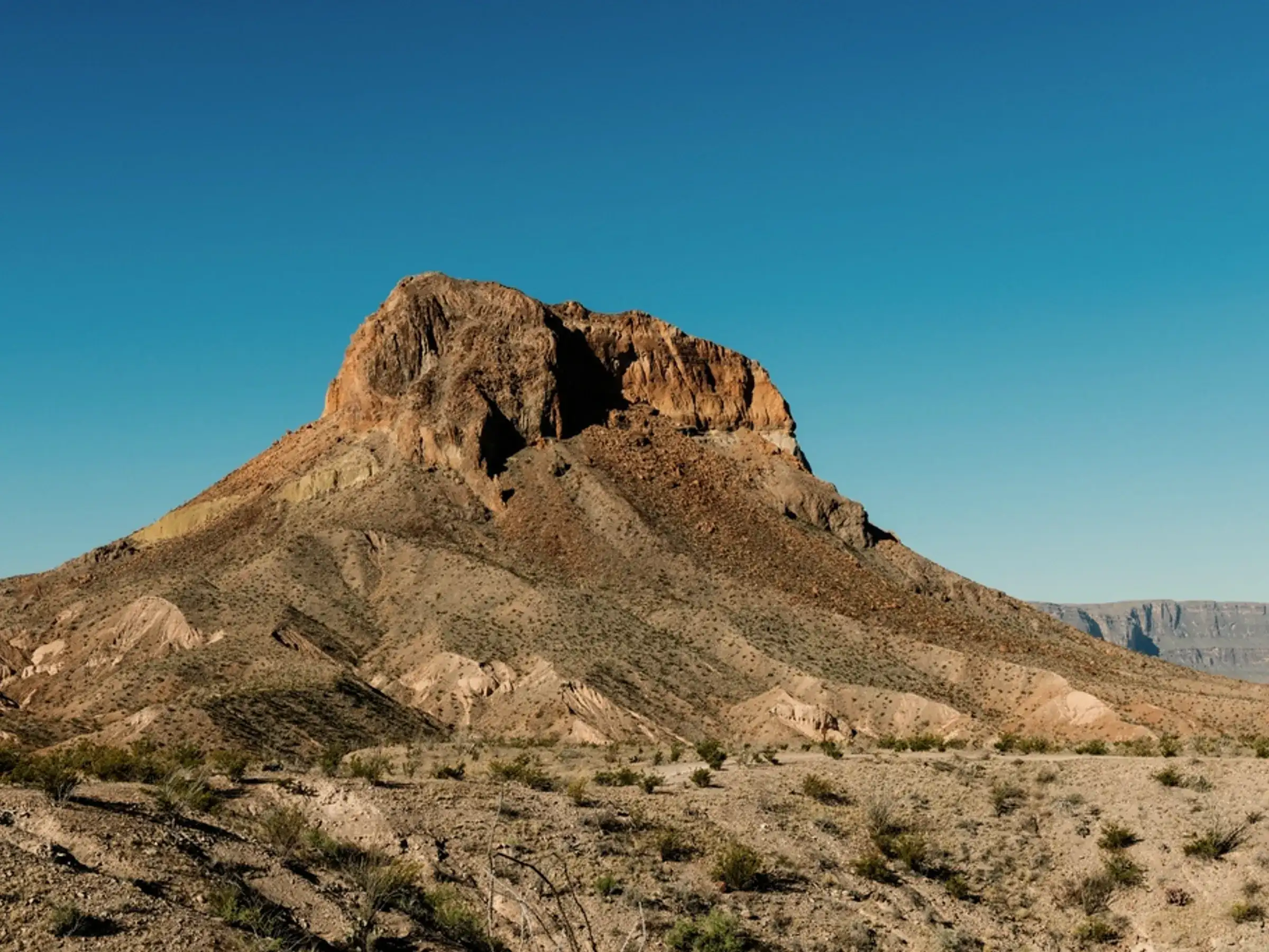 A lone butte and open desert in Big Bend National Park, West Texas